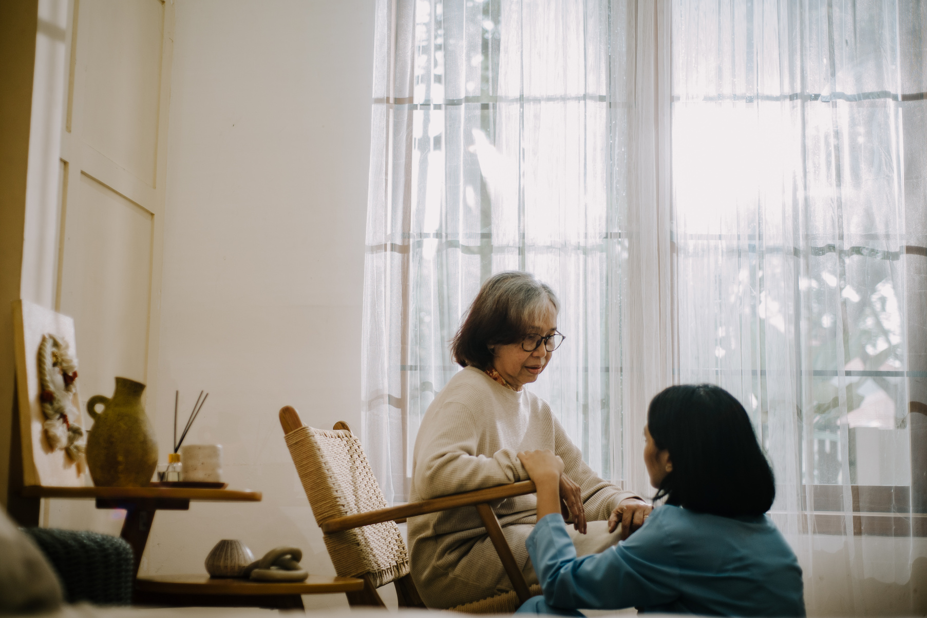 Nurse Taking Care of an Elderly Woman 